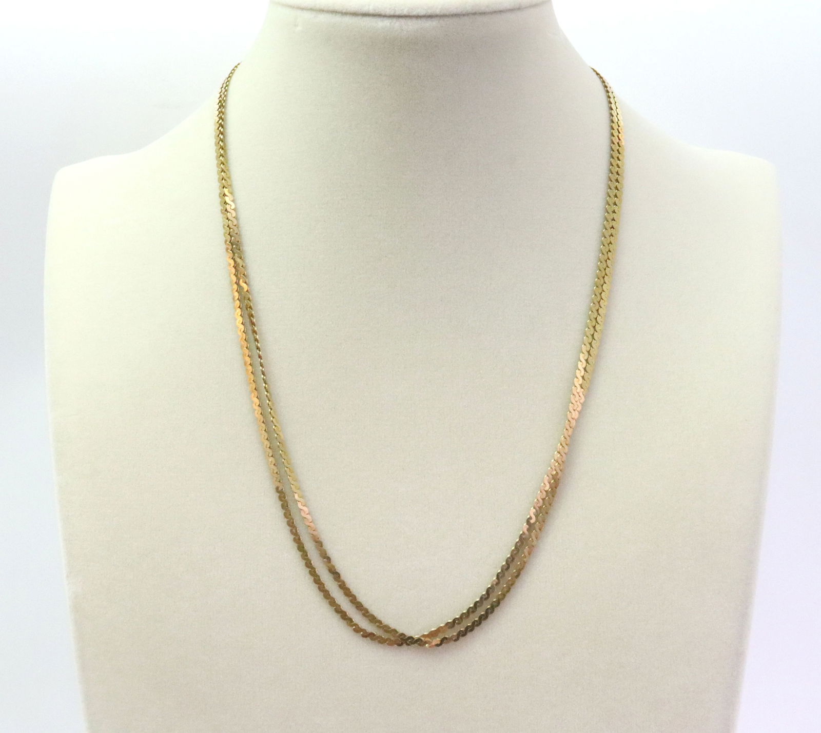 PAIR OF 14K SERPENTINE NECKCHAINS: each 18", stamped '14K Italy 585', gross weight 13.6gms., Opening Bid $700