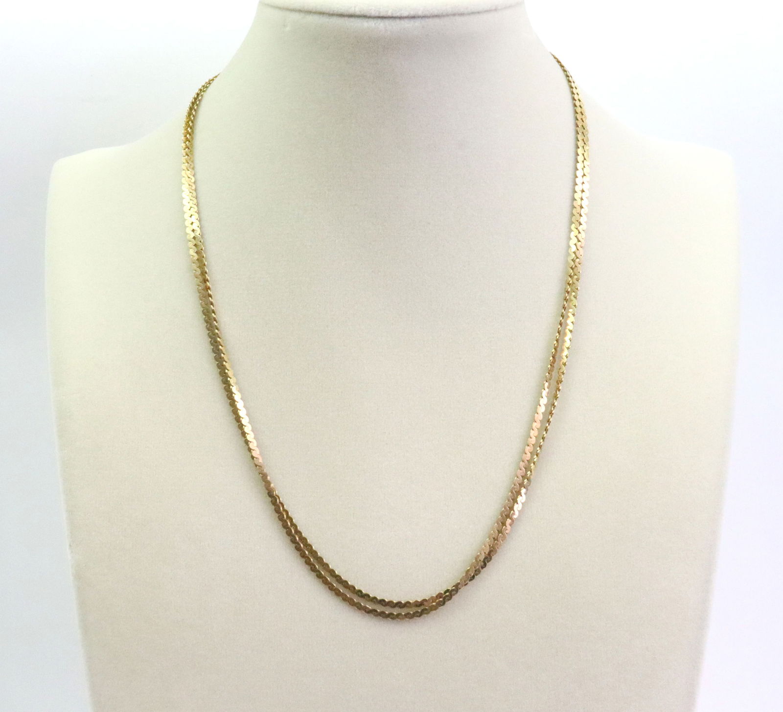 PAIR OF 14K SERPENTINE NECKCHAINS: each 18", stamped '14K Italy 585', gross weight 13.6gms., Opening Bid $700