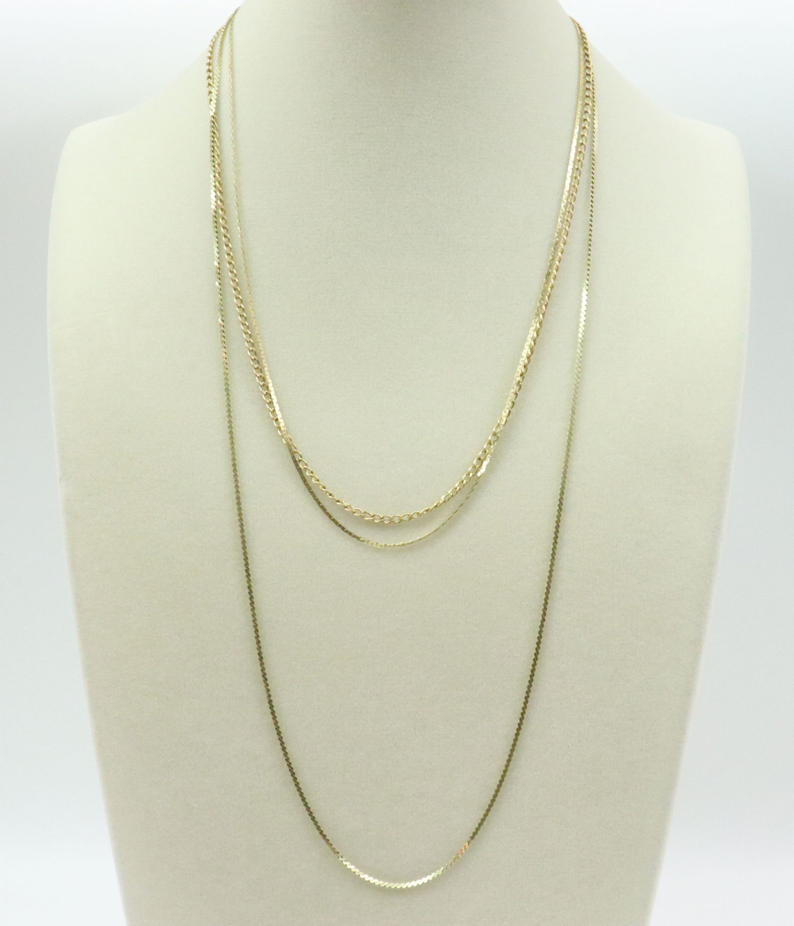 (3) 14K NECKCHAINS: including a 24" serpentine chain, an 18" C-link chain, and a 17.5" cable chain, the 2 thinner chains with some kinks, all stamped for 14K, 2 stamped Italy, gross weight 10.5gms., Opening Bid $500