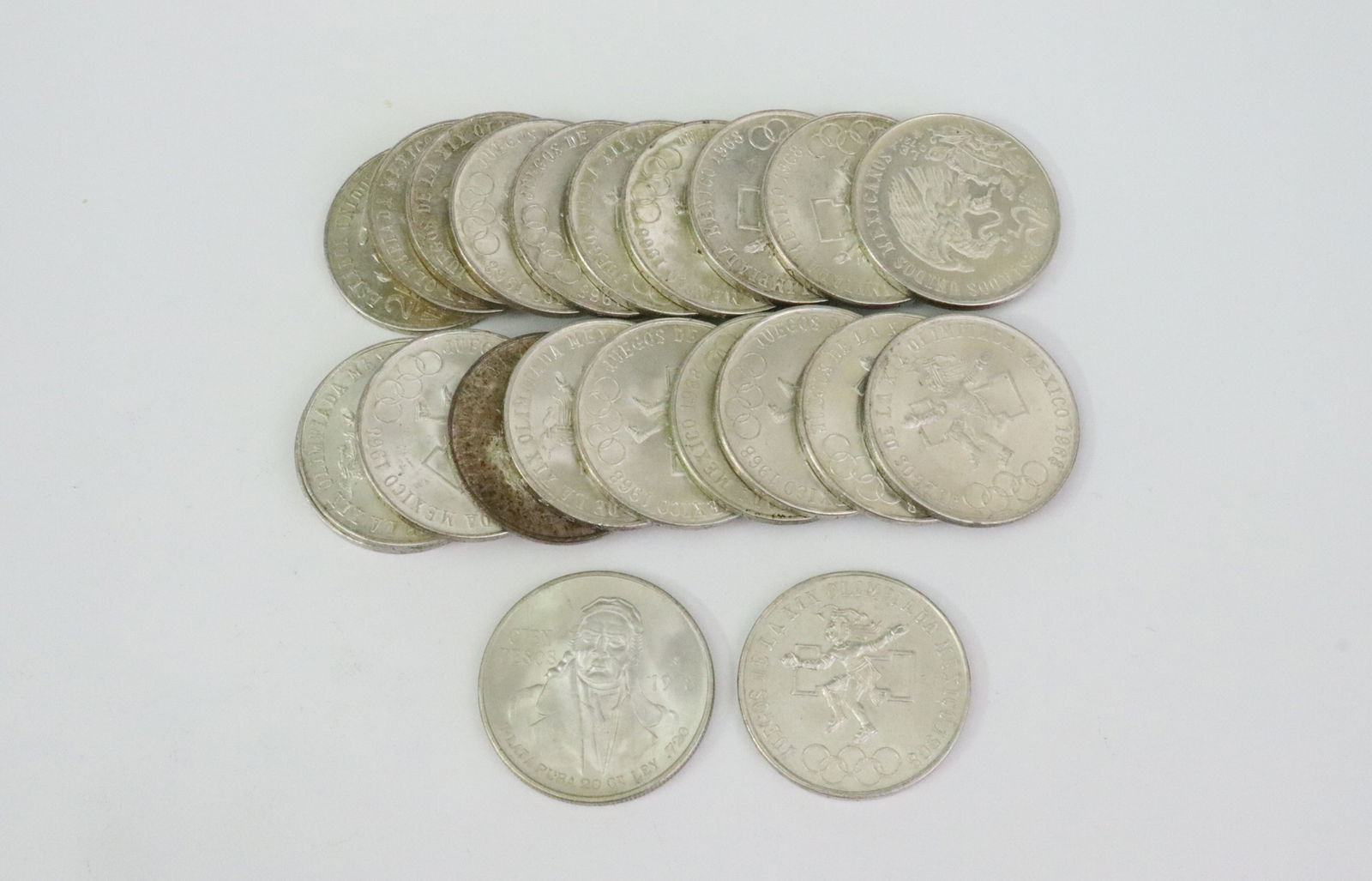 (22) MEXICAN .720 SILVER COINS: including 21-1968 Olympic 25 Peso coins, to celebrate hosting the 1968 Summer Olympics in Mexico City, silver weight .52ozt each, together with a 1978 Cien (100) Peso coin, silver weight .64ozt.,
