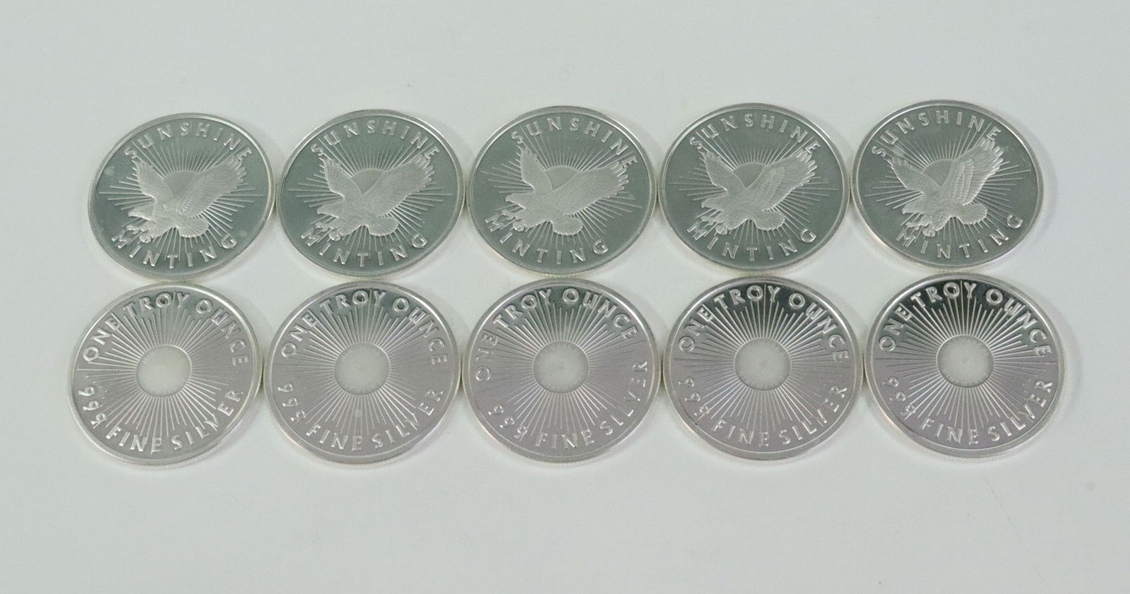 (10) SUNSHINE MINING 1 TROY OZ .999 SILVER ROUNDS: all with Mint Mark SI centers, Opening Bid $400