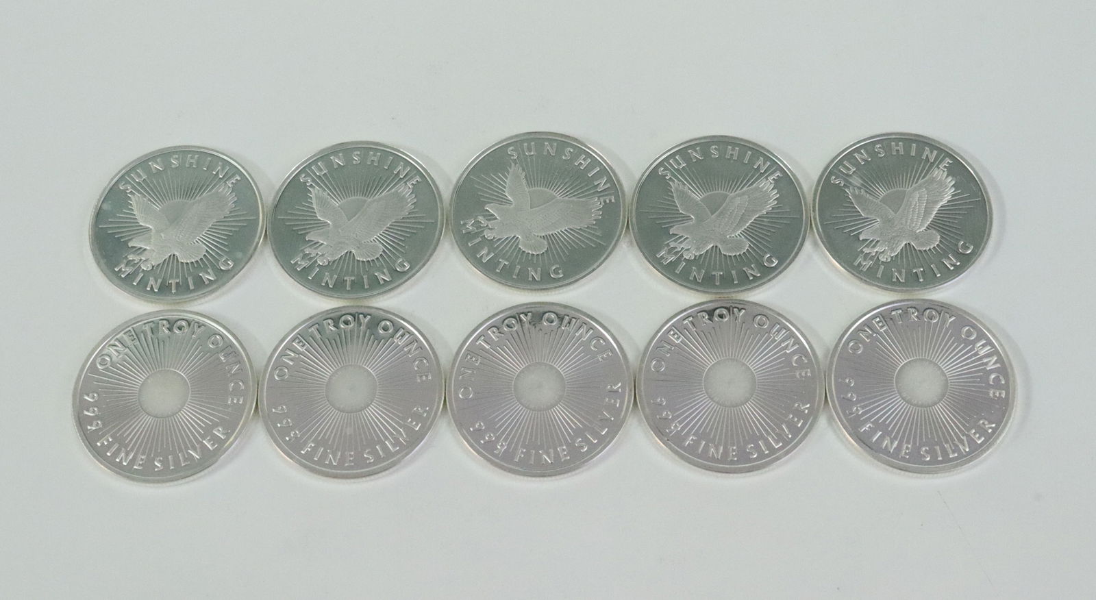(10) SUNSHINE MINING 1 TROY OZ .999 SILVER ROUNDS: all with Mint Mark SI centers, Opening Bid $400