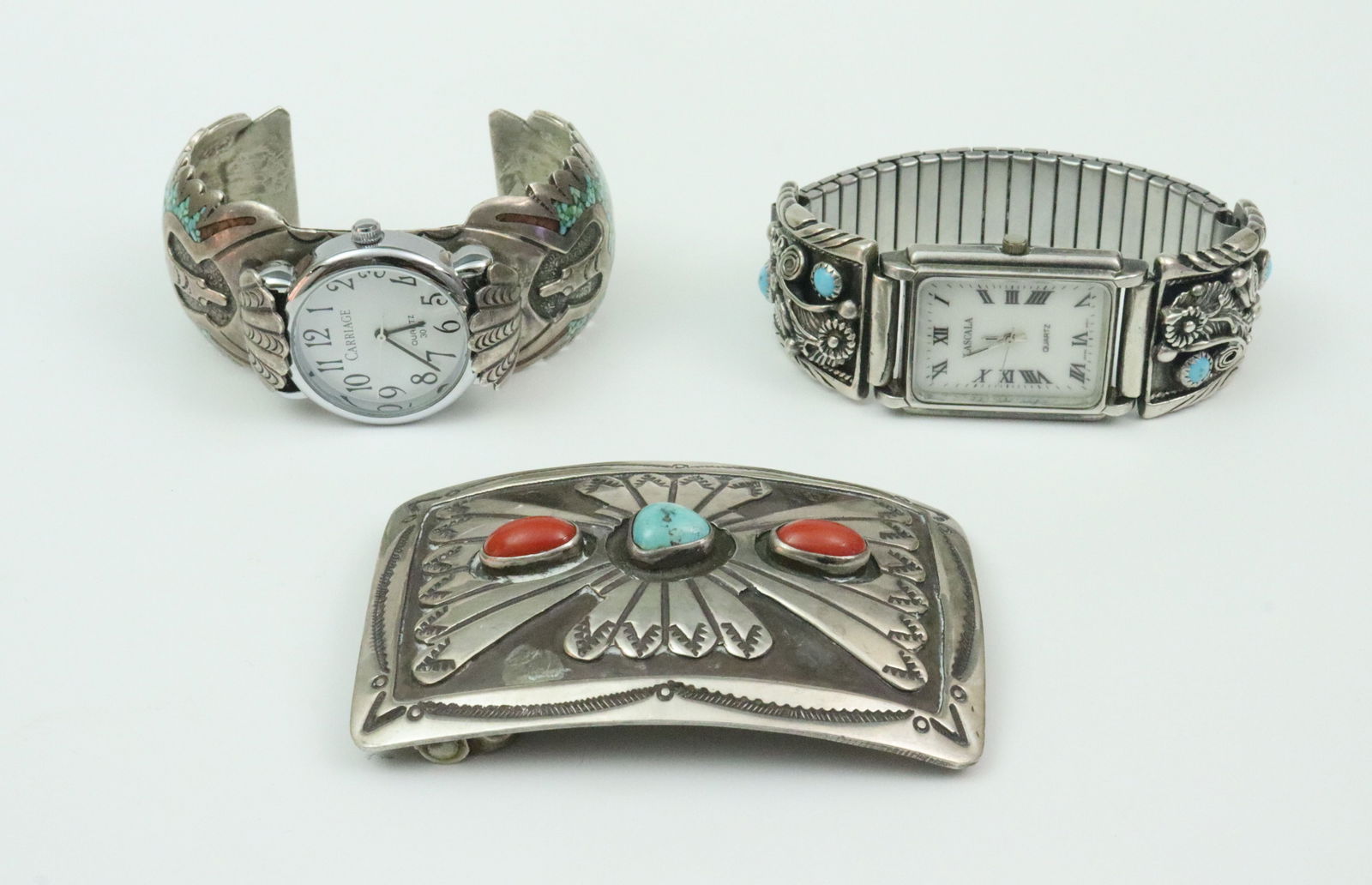 (2) SOUTHWESTERN WATCHES AND A BELT BUCKLE: including a 3x2" turquoise and coral belt buckle signed W. Douglas, likely Navaho, tests silver (swivel and pin not silver), 47.7gms., a turquoise cuff watch, dial marked 'Carriage Quartz', tests