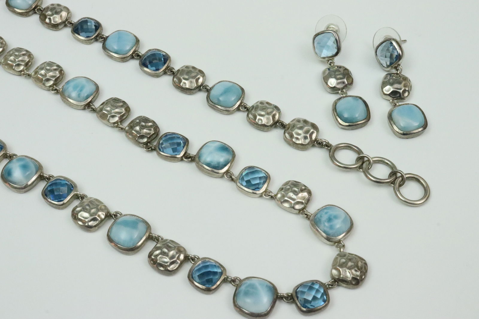 MARAHLAGO LARIMAR & BLUE SPINEL PARURE IN STERLING: comprising an 18-19" necklace, a 7-8" bracelet, and a pair of 1.6" dangle earrings (one post with slight bend), silicone and sterling clutch backs, all adorned with (10x10mm) cushion cut larimar