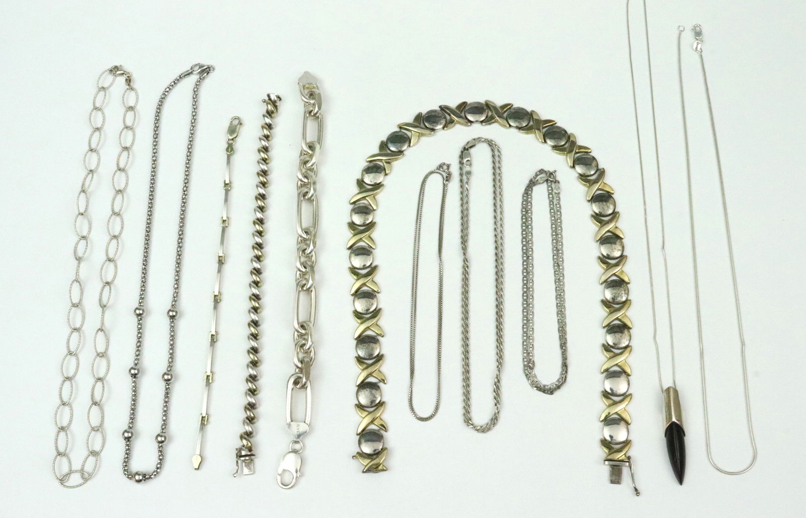 (11) PIECE ITALIAN 925 NECKLACE & BRACELET GROUP: including a 16" XO necklace, width 14mm, an 18" oval link necklace, an 18" popcorn chain with ball spacers, an 18" anchor chain, a 20" rope chain, a 20" box link trace chain, 2 18" omega chains (one