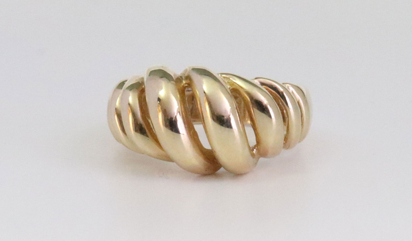 14K DOME RING: in filigree ribbed design, height 10mm, in yellow gold, tests 14K, size 5.5, 5.9gms., Opening Bid $300