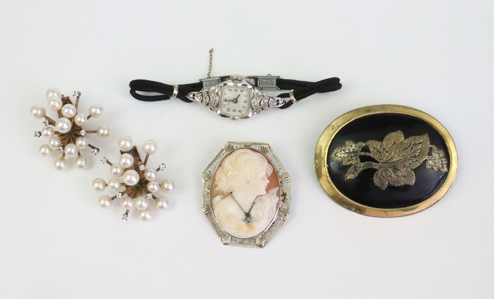 (4) PIECE JEWELRY GROUP: including a 14K white gold filigree cameo pin / pendant with accent diamond (minor solder remnant to cameo's necklace at pendant point), 1.4in., 7.8gms., a ladies 14K Bulova white gold case watch