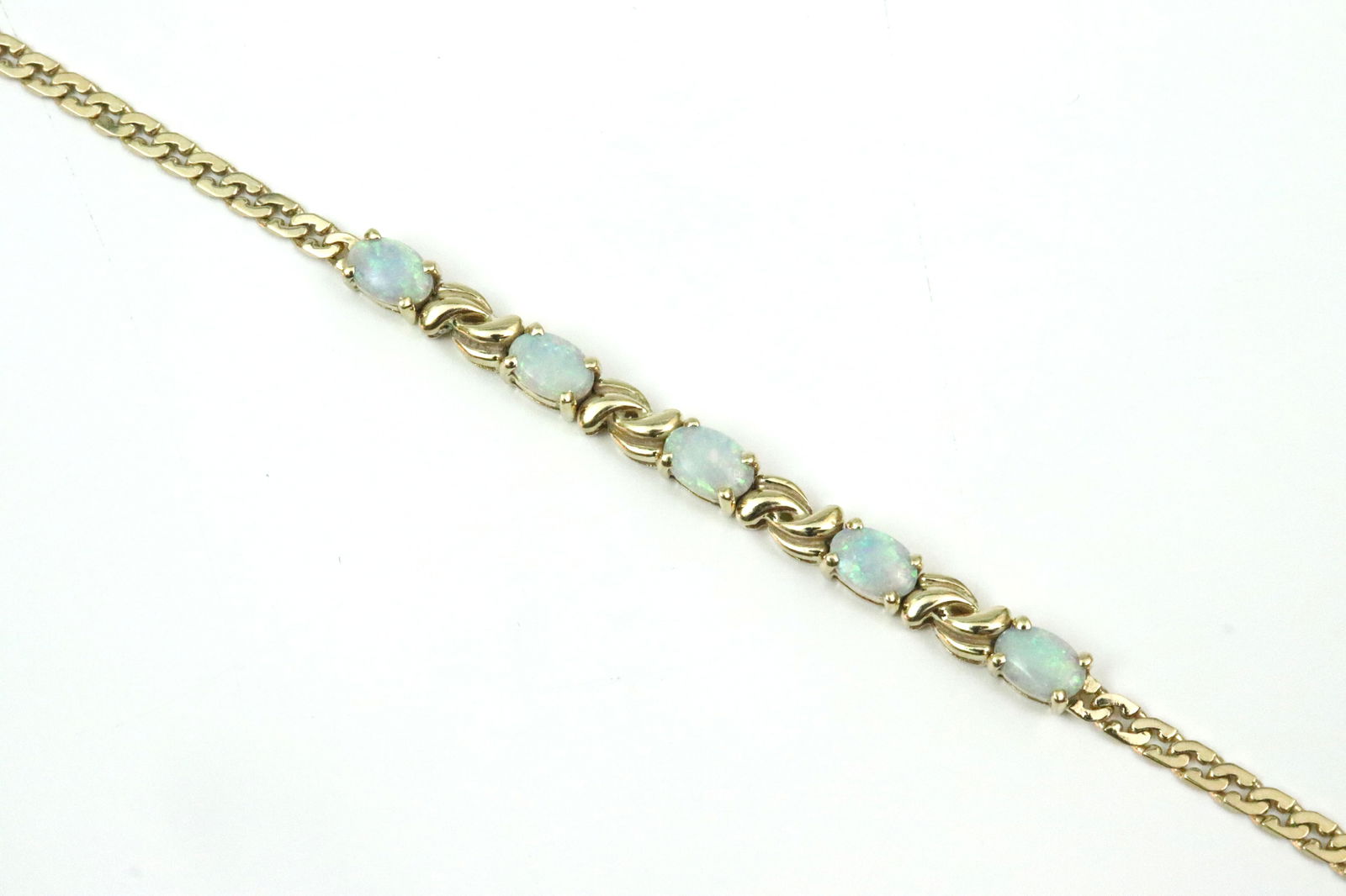 14K CURB LINK OPAL BRACELET: set with 5 central opals approx. 0.95ctw, in yellow gold, stamped 585, safety catch, 6.75in., 5.7gms., Opening Bid $300