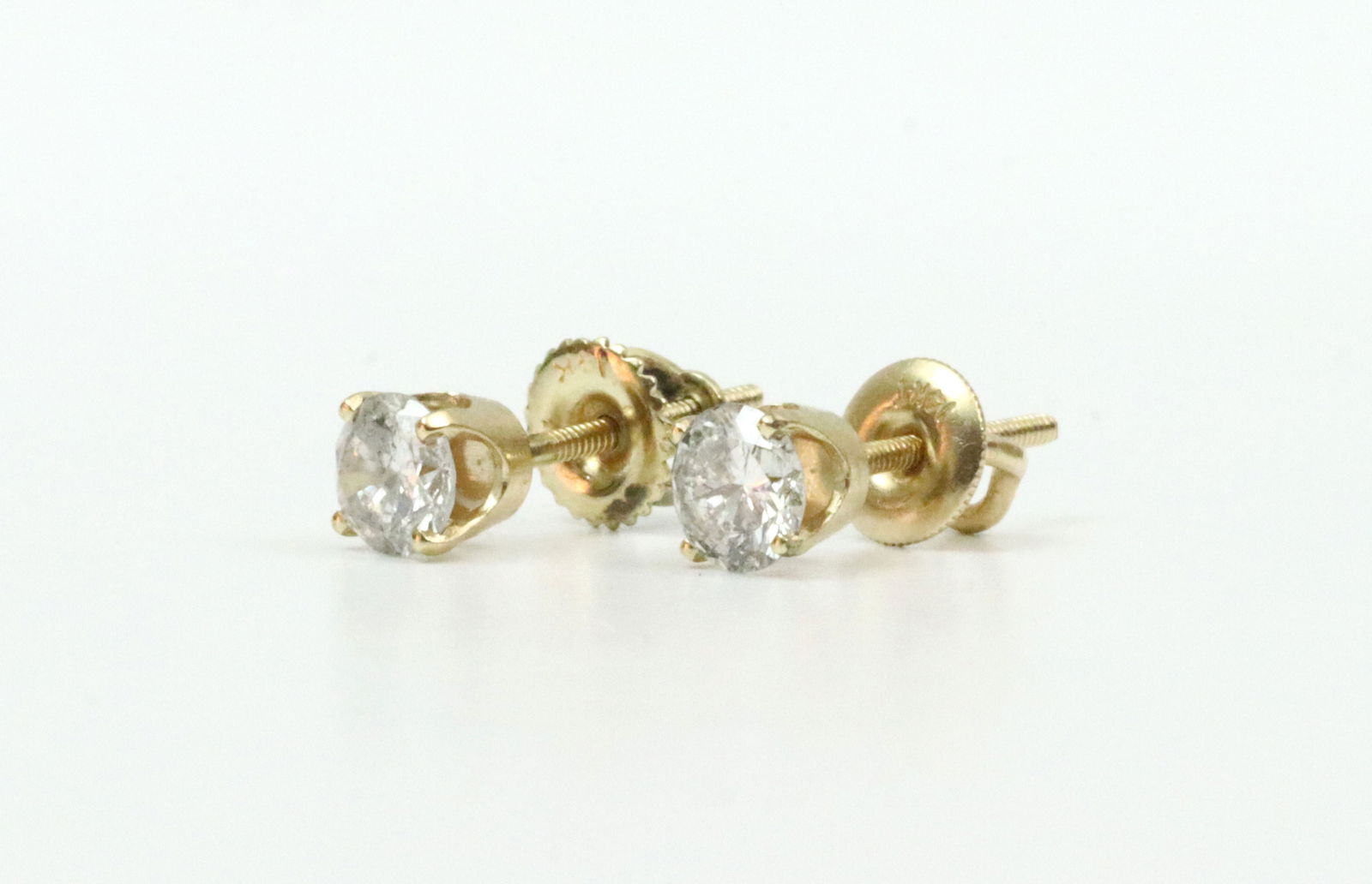 PAIR 14K DIAMOND STUD EARRINGS: threaded back earrings each set with a round cut natural diamond approx. 0.40-0.44ct (in our opinion: G color, I1-2 clarity, however not guaranteed), total diamond weight for the pair approx.