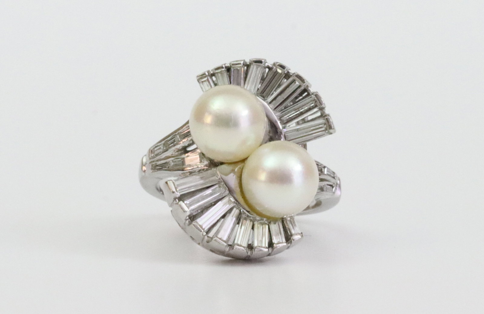 14K TWIN PEARL & DIAMOND RING: set with 2 (7.5mm) cultured pearls, and 28 natural diamond baguettes approx. 2.54ctw, overall ring head 20x15mm, light adhesive remnant at base of pearls mainly observed under magnification, in white