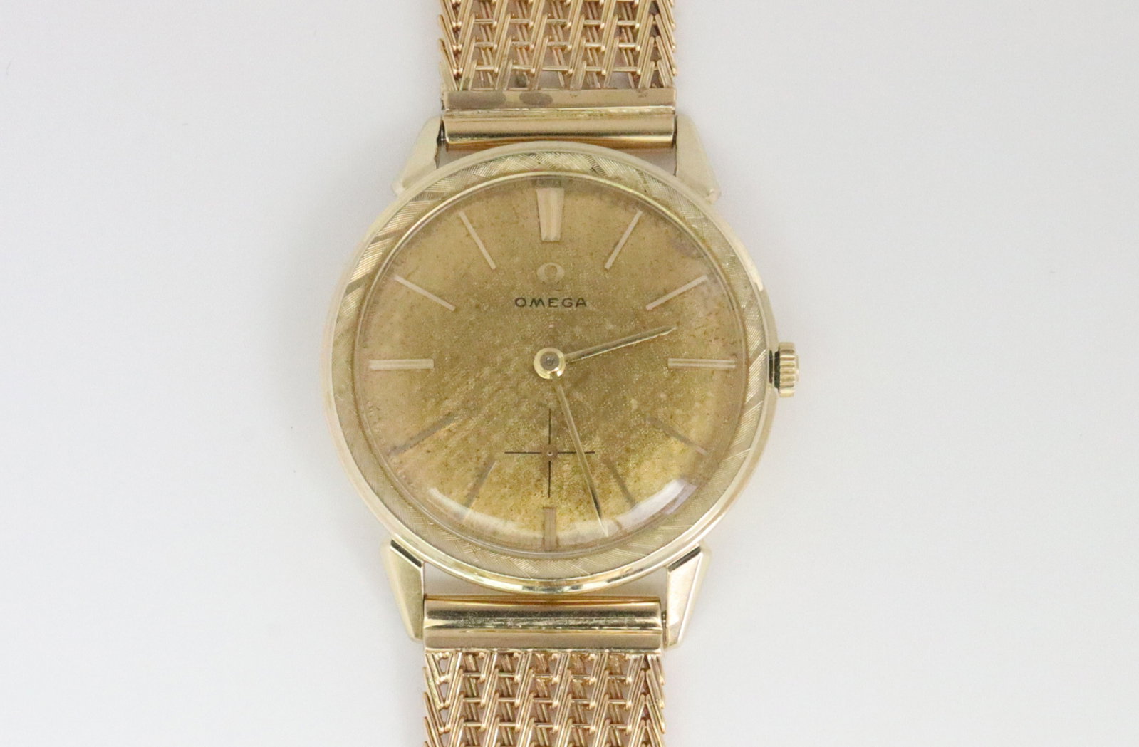 VINTAGE OMEGA 14K/18K BRACELET WATCH: 33mm Jonell case, textured goldtone dial stamped Omega, stick markers and seconds subdial, caseback with presentation inscription dated 61, stamped '14K Gold', case interior stamped 'Omega Watch Co. N