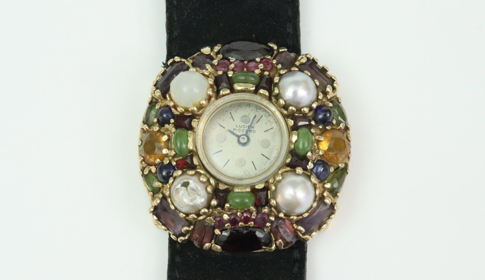 LUCIEN PICCARD 14K GEM-SET COCKTAIL WATCH: 17mm case, 31mm multi gemstone bezel, tests 14K, dial stamped 'Lucien Piccard' (some dial oxidation, crystal scratch), caseback stamped '083871', rear wind 17 jewel manual movement stamped 'Lucien