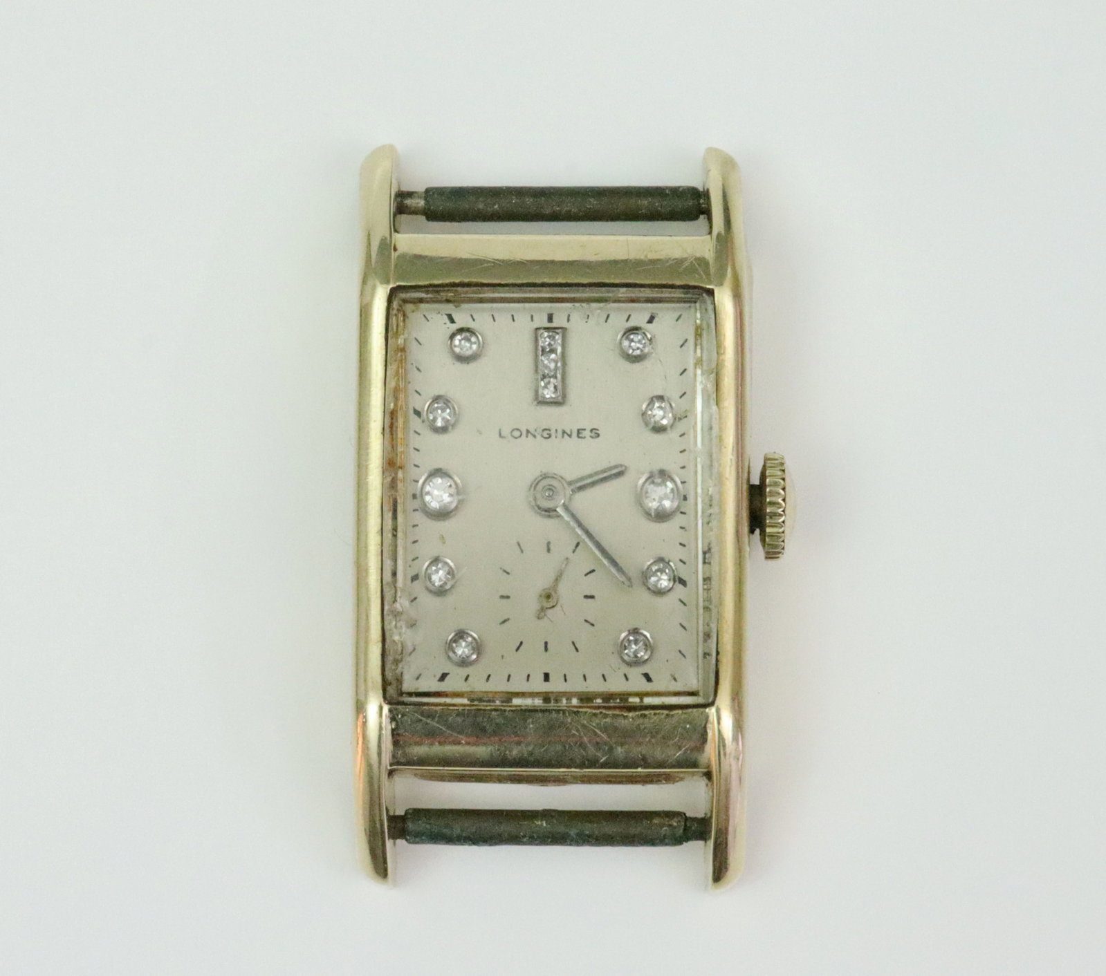 LONGINES 14K GOLD WATCH CASE WITH DIAMOND MARKERS: 21x39mm including lugs, silvertone dial stamped Longines, 13 round diamond hour markers (3 at noon), seconds subdial, Kaspar & Esh case interior stamped 'Longines-Wittnauer Watch Co. Inc. New York 14K