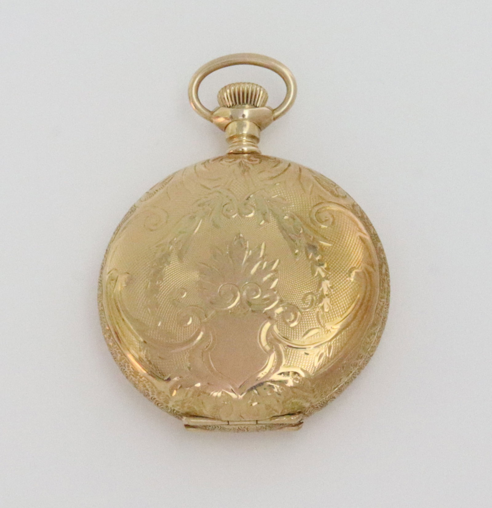 LADIES 14K WALTHAM HUNTER CASE POCKET WATCH: c.1912, 34mm, scroll and floral decorated hunter case with incised landscape, dial marked Waltham, seconds subdial and red minute numerals, caseback interior stamped 'Keystone 14K 4722973', cuvette st