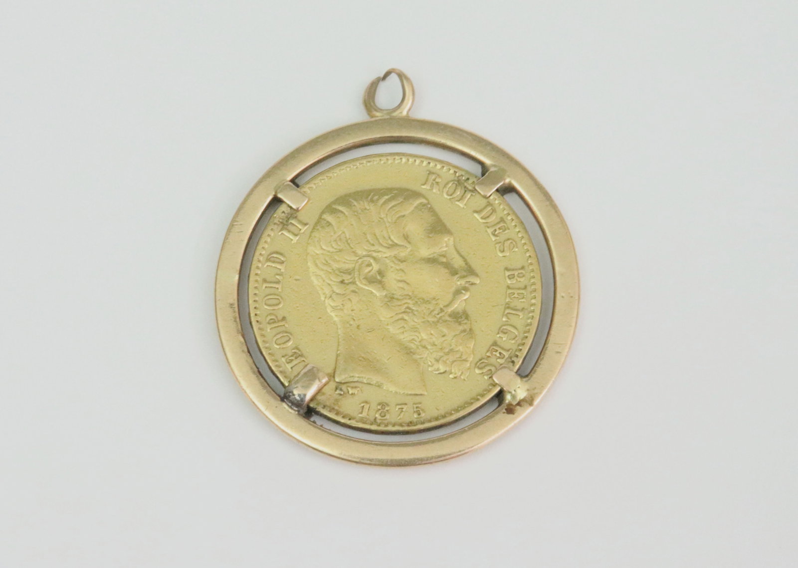 1875 BELGIUM 20 FRANC GOLD COIN: .900 purity, 6.45gms., ungraded, mounted in a tested 18K tab-set pendant holder (split bale), gross weight 9.25gms., Opening Bid $500