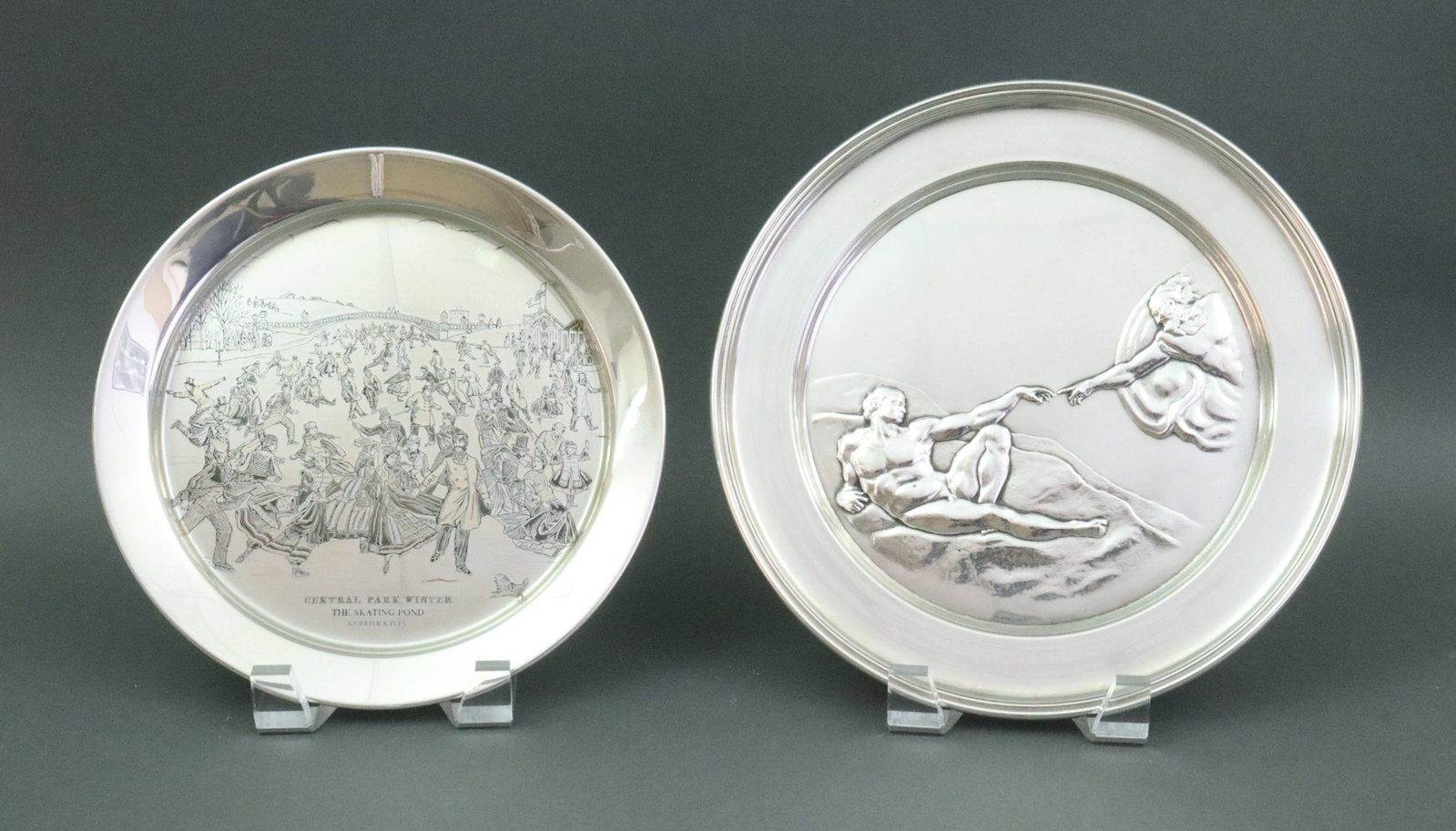 (2) DANBURY MINT STERLING COLLECTOR PLATES: including "The Creation of Adam" #148, manufactured in London with punch marks for Richard Comyns 1972, 9in., and "Central Park Winter" by Reed & Barton, 1973, in gold and copper over sterling,