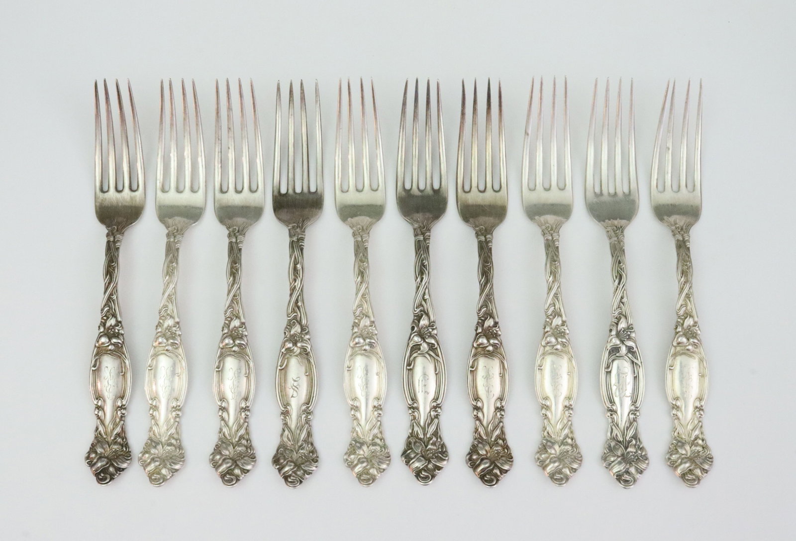 (10) INTERNATIONAL SILVER STERLING PLACE FORKS: in Frontenac pattern, 7.1in., 15.3ozt., monogrammed, Opening Bid $600