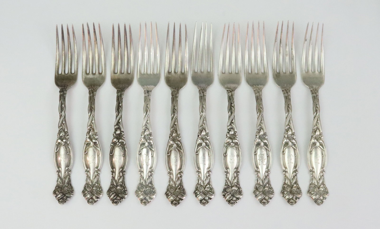 (10) INTERNATIONAL SILVER STERLING PLACE FORKS: in Frontenac pattern, 7.1in., 14.8ozt., monogrammed, Opening Bid $600