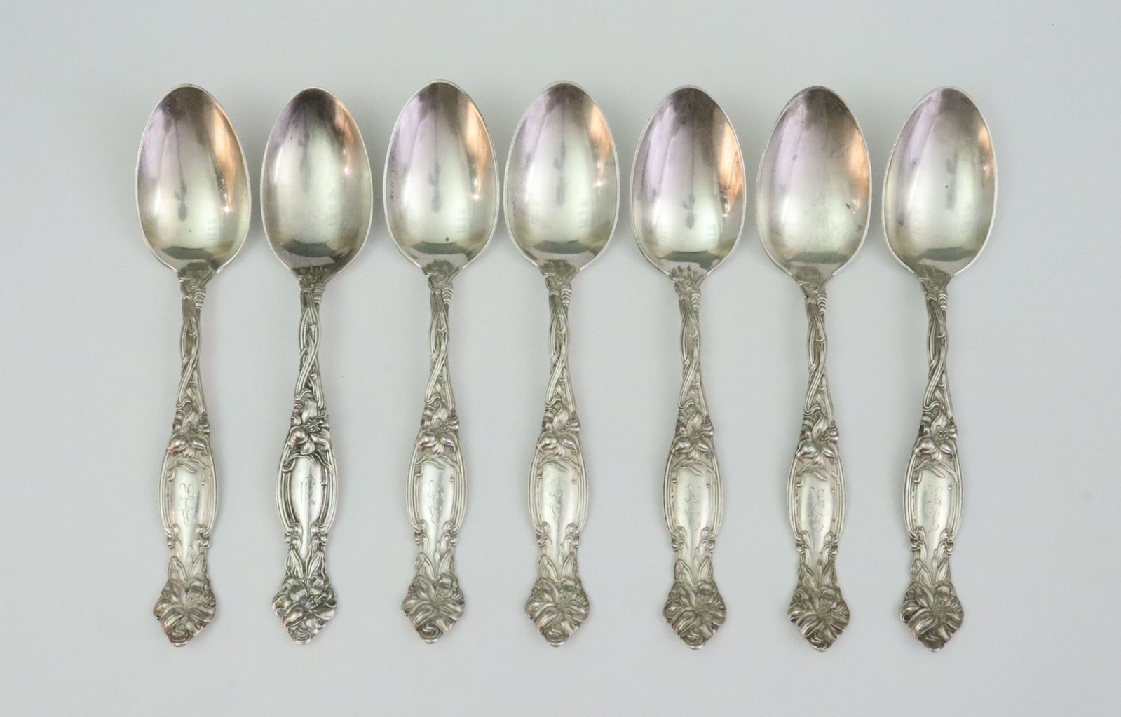 (7) INTERNATIONAL SILVER STERLING OVAL SOUP SPOONS: in Frontenac pattern, 7.1in., monogrammed, 11ozt., Opening Bid $400