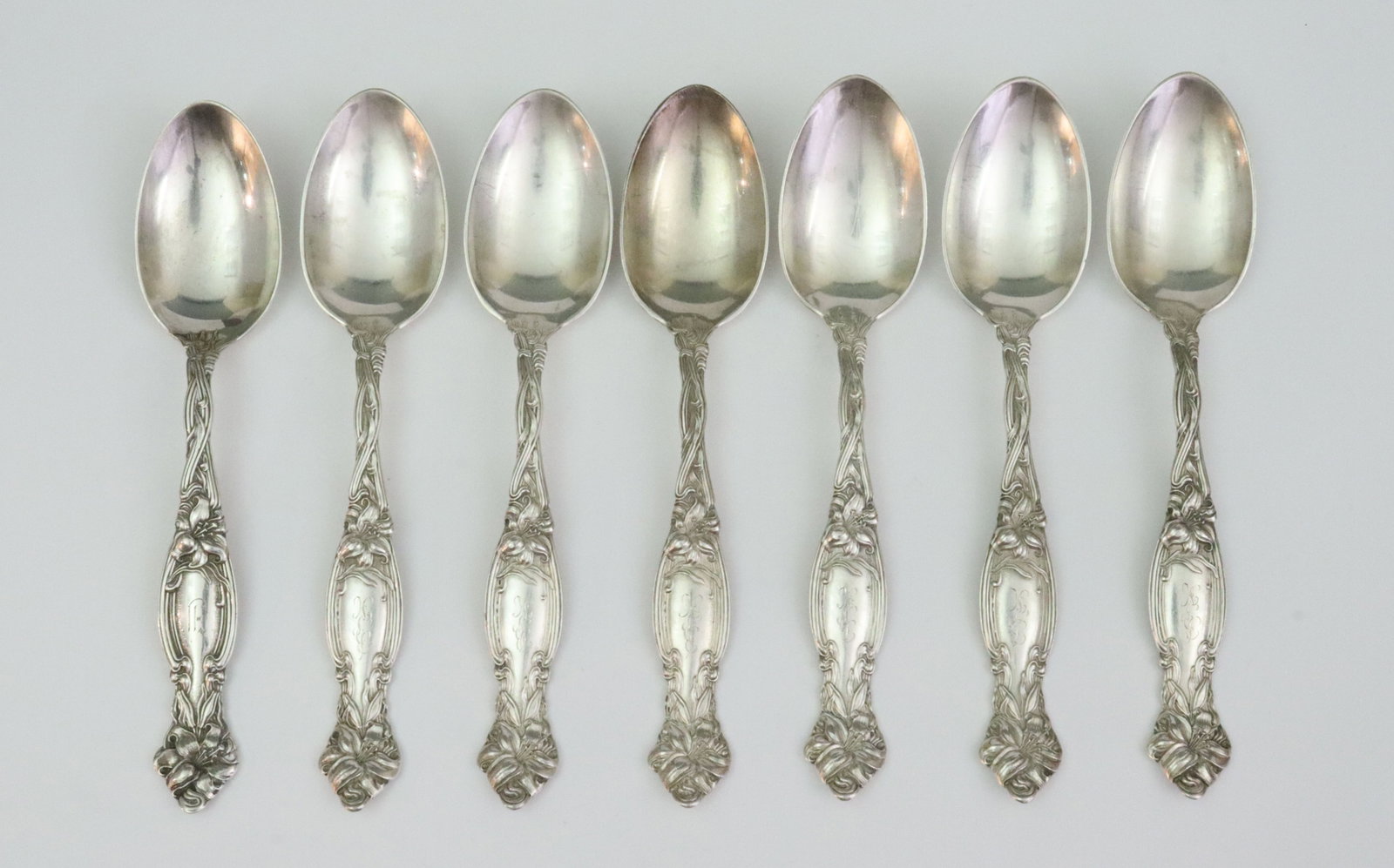(7) INTERNATIONAL SILVER STERLING OVAL SOUP SPOONS: in Frontenac pattern, 7.1in., monogrammed, 11.2ozt., Opening Bid $400