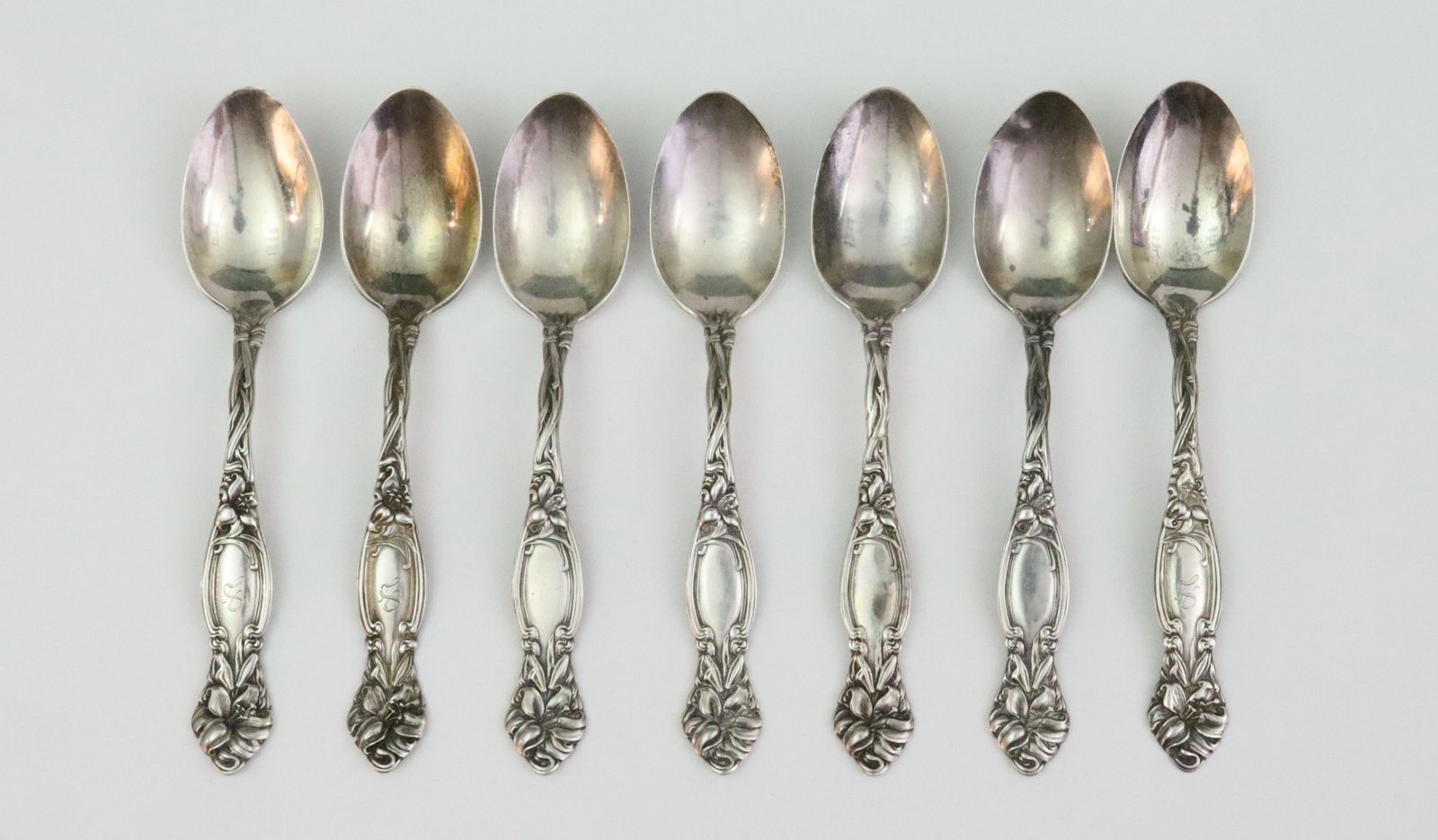 (7) INTERNATIONAL SILVER STERLING 5 O'CLOCK SPOONS: in Frontenac pattern, 5.5in., several monogrammed, 4.4ozt., Opening Bid $150
