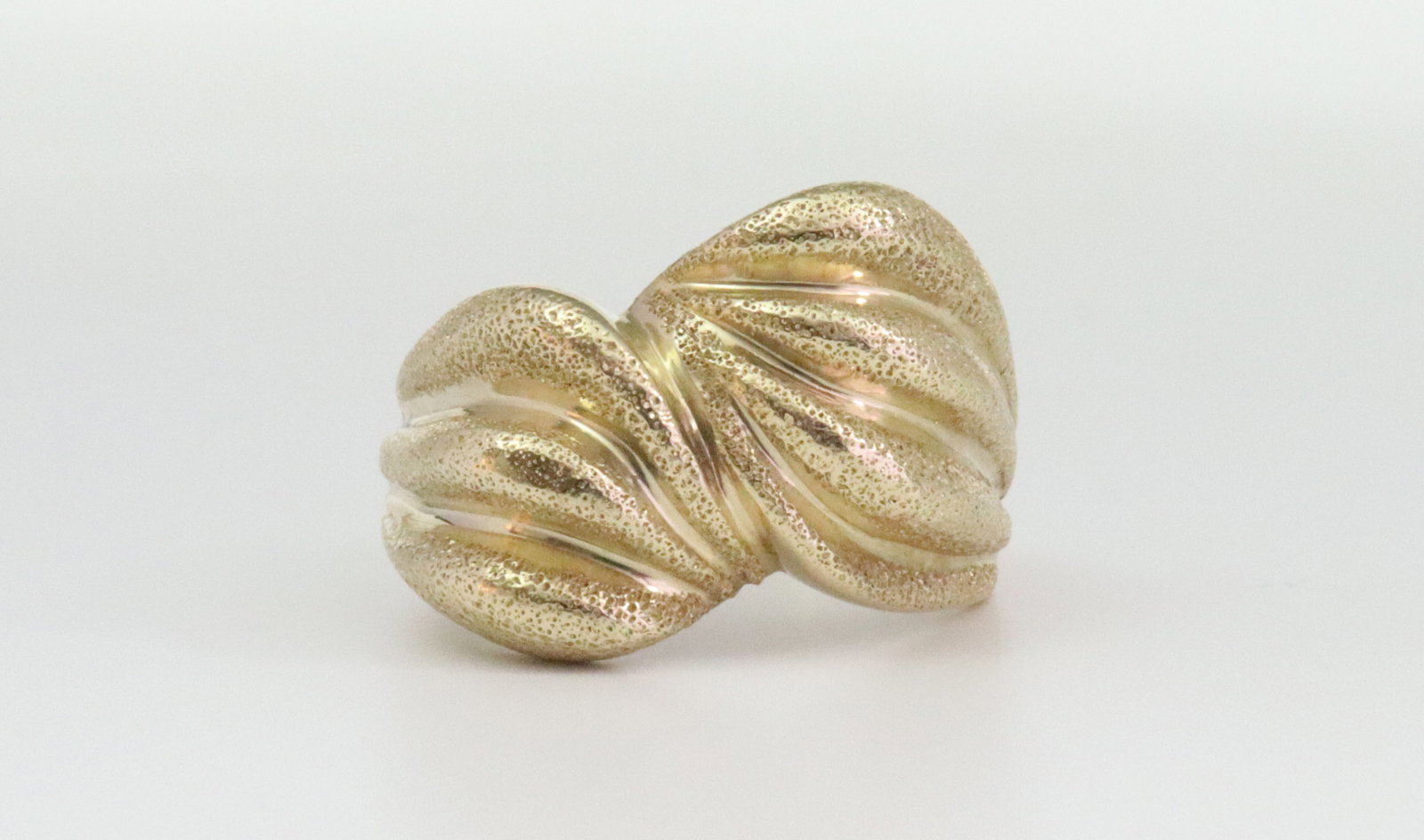 14K GOLD RIBBED DOME RING: in textured yellow gold, height 14mm, stamped 14KP, size 8.75, 7.3gms., Opening Bid $300