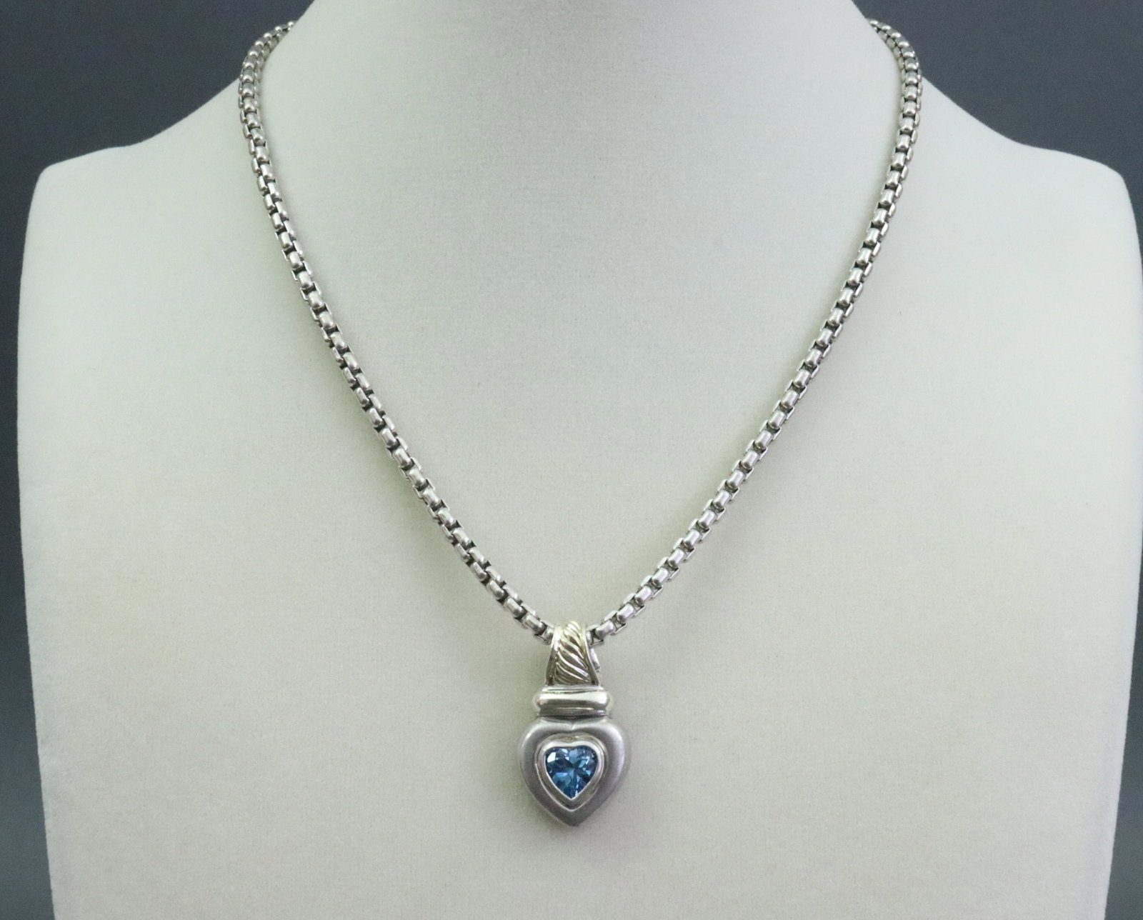 DAVID YURMAN 925 / 585 HEART PENDANT ON CHAIN: comprising a topaz heart pendant with hinged bale, stamped 'DY 925 585', length 1.2in., on sterling box chain stamped 925, and with 14K signature tag, 16in., gross weight 33.8gms.
