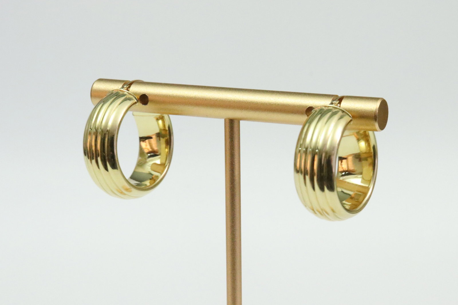 PAIR ITALIAN 18K HOLLOW GOLD HOOP EARRINGS: in ribbed design, thickness 8mm, drop length 22mm, in yellow gold, each stamped '18KT Italy', and with Italian hallmark 804 AR (Arezzo), gross weight 3.9gms., Opening Bid $200