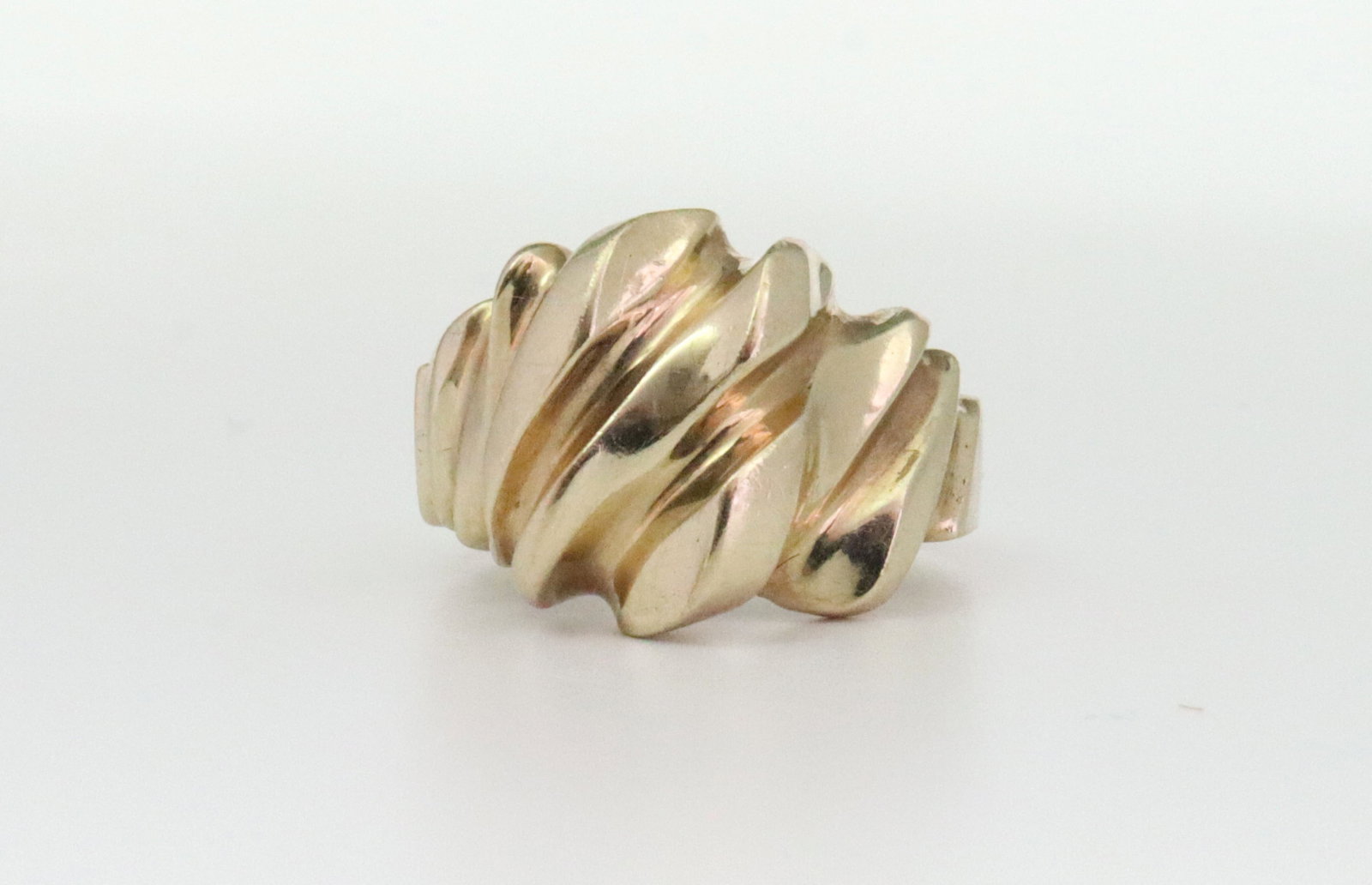 BICOLOR 10K BRUTALIST GOLD RING: in yellow and rose gold, height 15mm, stamped 10K, size 7.25, 5.9gms., Opening Bid $200