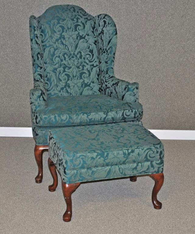 ETHAN ALLEN QUEEN ANNE-STYLE WING CHAIR & OTTOMAN: in dark green damask with foliate motif, labels of Ethan Allen (wood with minor dings and scuffs commensurate with age and use), 44in.
