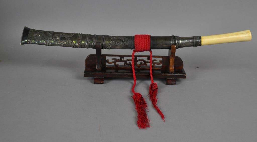 BONE-HANDLED SHORT SWORD: the scabbard decorated in relief, on wood stand, blade length 13in., overall 20in. (wear, cracks, losses, blade nicks)