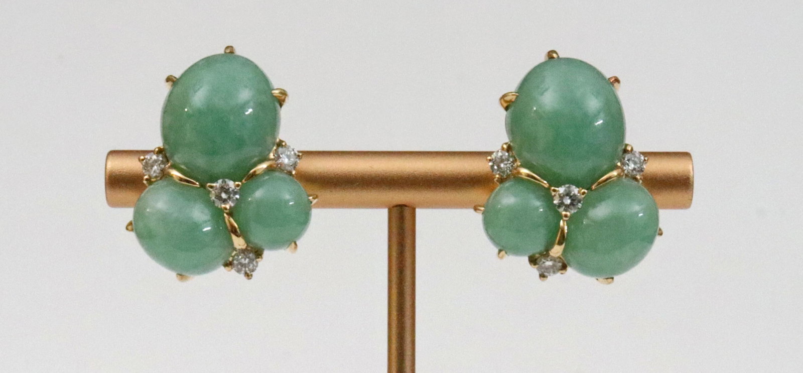 SEAMAN SCHEPPS THREE CAB JADE & DIAMOND EARRINGS: each earring set with 3 jade cabochons, largest cab 14x12x6.6mm, accented with 4 round natural diamonds approx. 0.72ctw, in 18K yellow gold, stamped 'Seaman Schepps 750 22910', and with stylized shell
