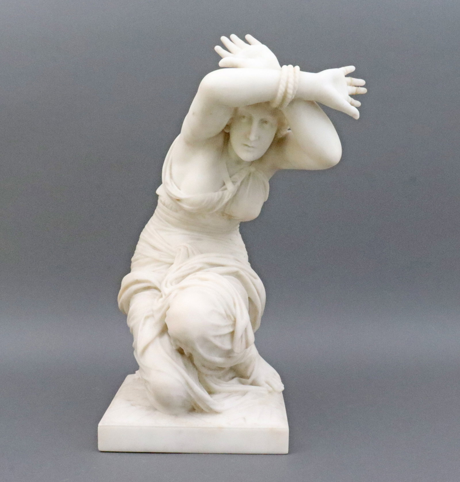 AFTER JEAN JULES CAMBOS (French, 1827-1917): La Femme Adultere (The Adulterous Woman), carved alabaster, incised 'Cambos 1866' to base verso, estate piece, condition issues include crude repair to 4 fingers on right hand exhibiting old glue