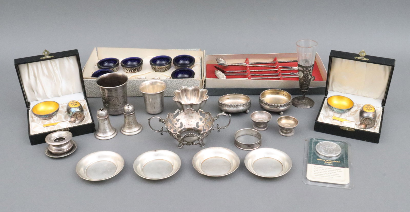 (40) PIECE GROUP VARIOUS STERLING TABLE ARTICLES: including 2 boxed Danish MEKA 3-piece salt & shaker sets, a boxed set of 6 Silvercraft salts with cobalt liners and 4 salt spoons (box tears), a Russian enameled vodka cup with niello decoration, a