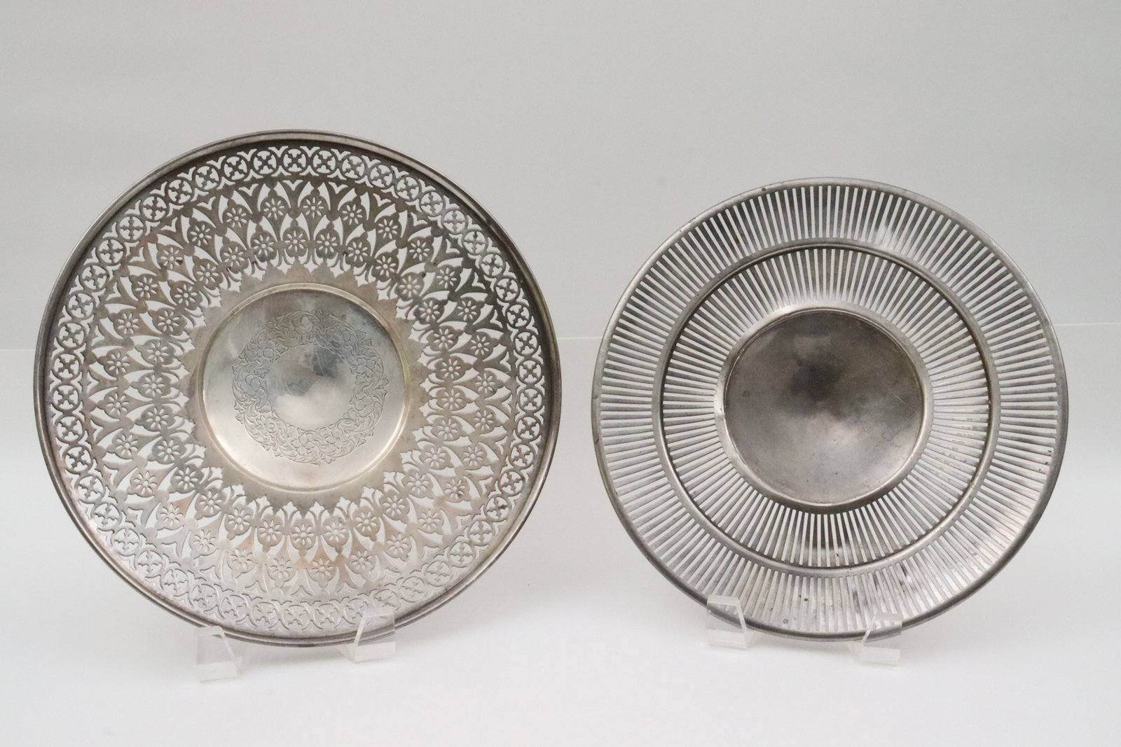 (2) STERLING RETICULATED FOOTED TRAYS: one by Meriden Brittania, 9.75in., the other by James E. Blake (partially separated foot), 9in., 15.6ozt., Opening Bid $400