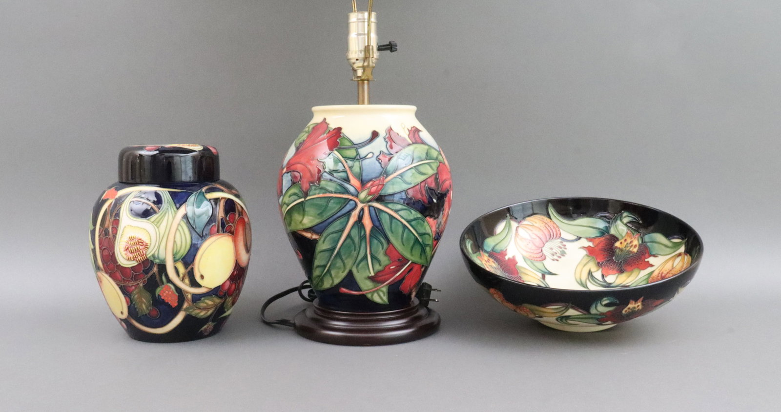 (3) LARGE MOORCROFT POTTERY ITEMS: including an Anna Lily bowl, c.1998, 10x3.5in., a Queens Choice ginger jar, c.2000, 8in., and a Simeon pattern table lamp, pottery height 8.5in., overall to finial top 23in., with Moorcroft shade, eac