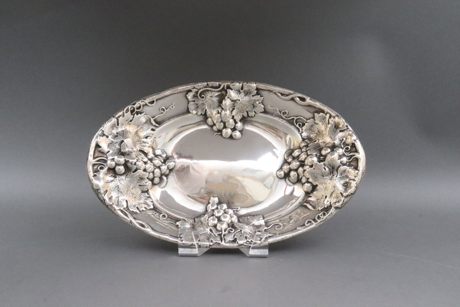 MAUSER STERLING REPOUSSE GRAPE BOWL: with heavy repousse grape cluster and leaf design, stamped 925/1000 fine, Sterling, 680 and maker, 11.25x7in., 7.5ozt., Opening Bid $225