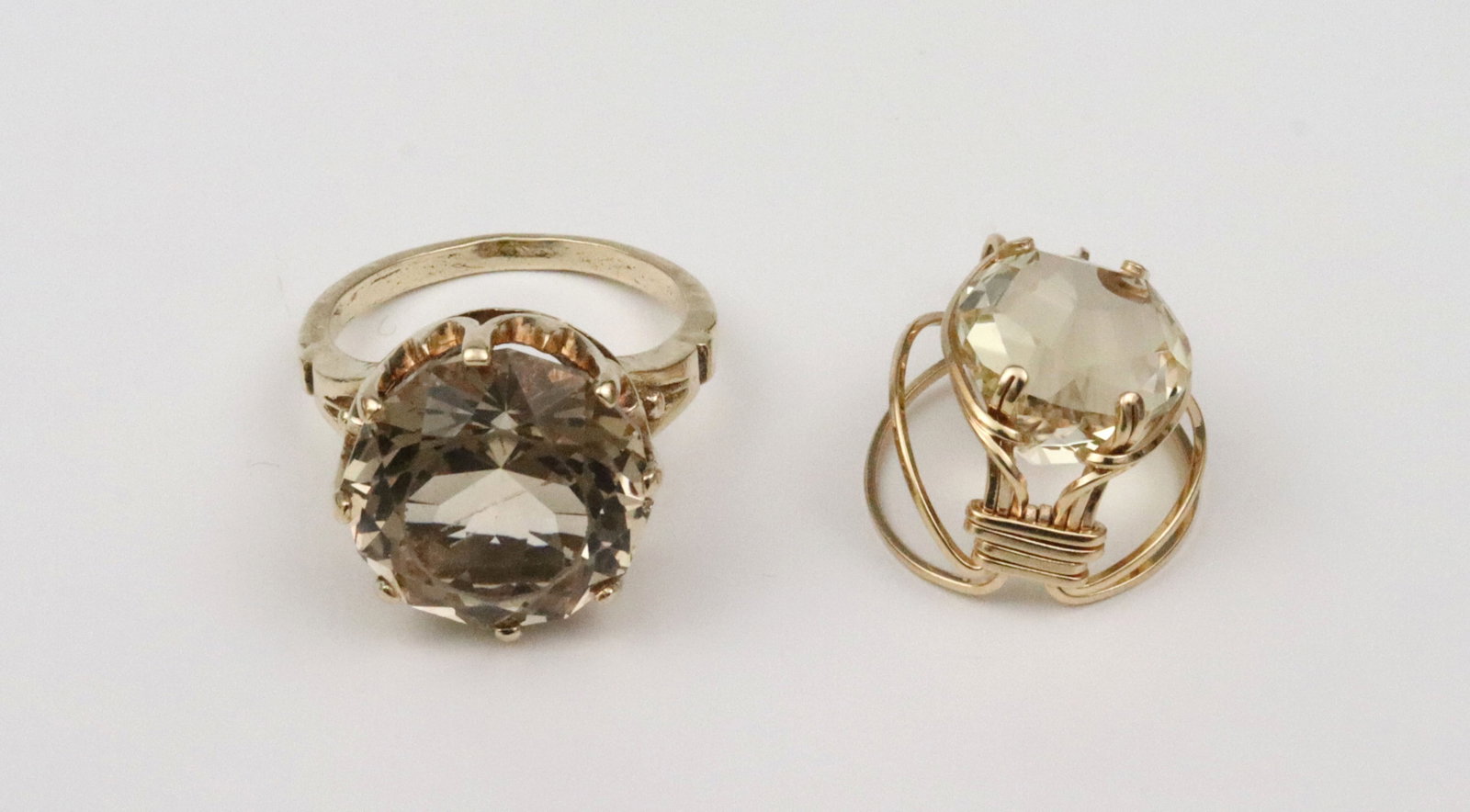 GOLD & YELLOW BERYL RING & PENDANT: each set with a round beryl stone, the ring approx. 13.00ct (14.3mm), stone scratch and scuffs, tests 10K (stamped 14K), size 8, 7.2gms., the pendant approx. 8.50ct (11.3mm), in wire wrapped setting,