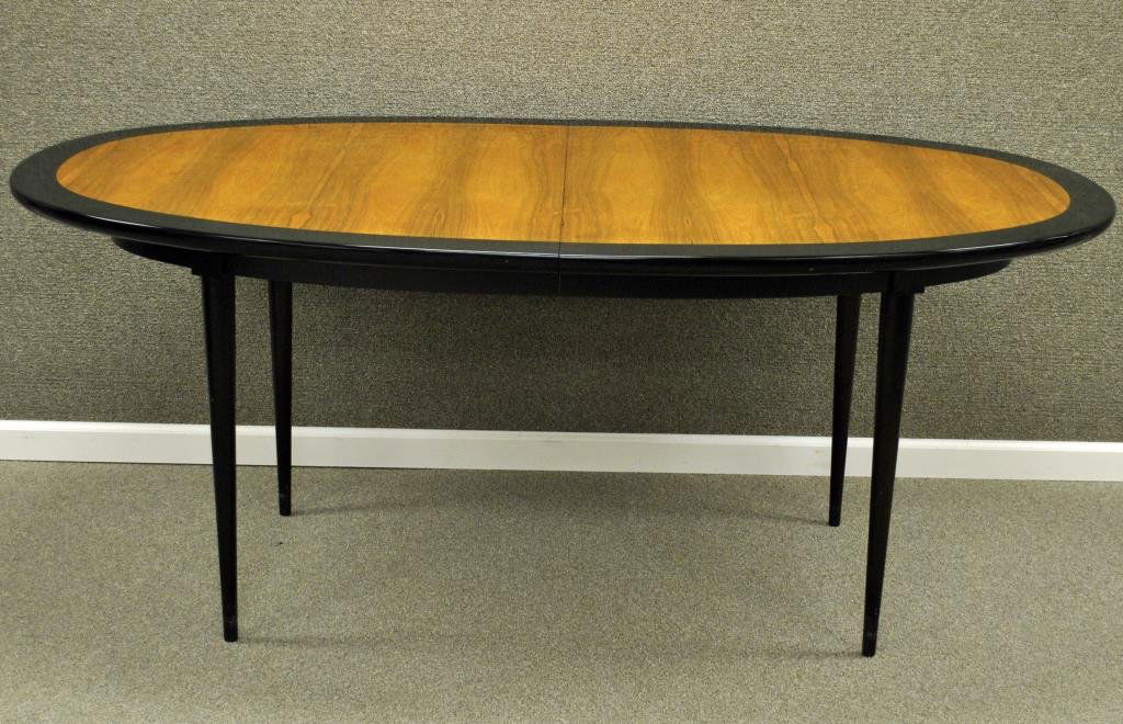 HARVEY PROBBER DINING TABLE: in oval form with ebony finish banded top, on tapered legs, 29x72x41in. with four 16" leaves (leaves with finish cracks and chips) extending table to 136in. (center support lacking), unsigned Conditio
