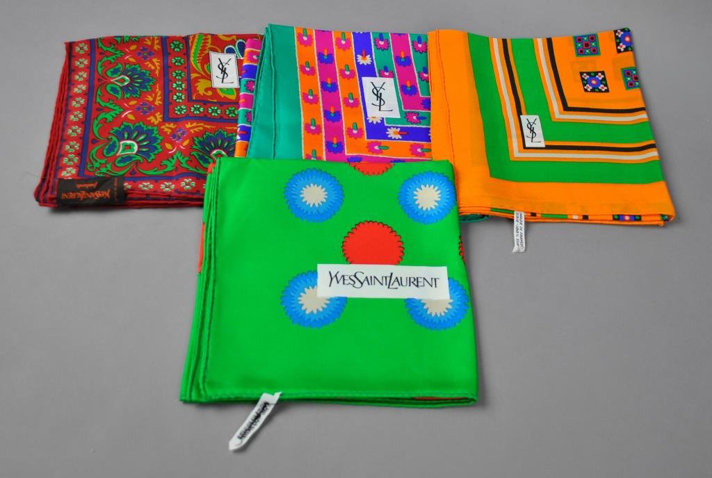 FOUR YVES SAINT LAURENT DESIGNER SCARVES: in floral patterns
