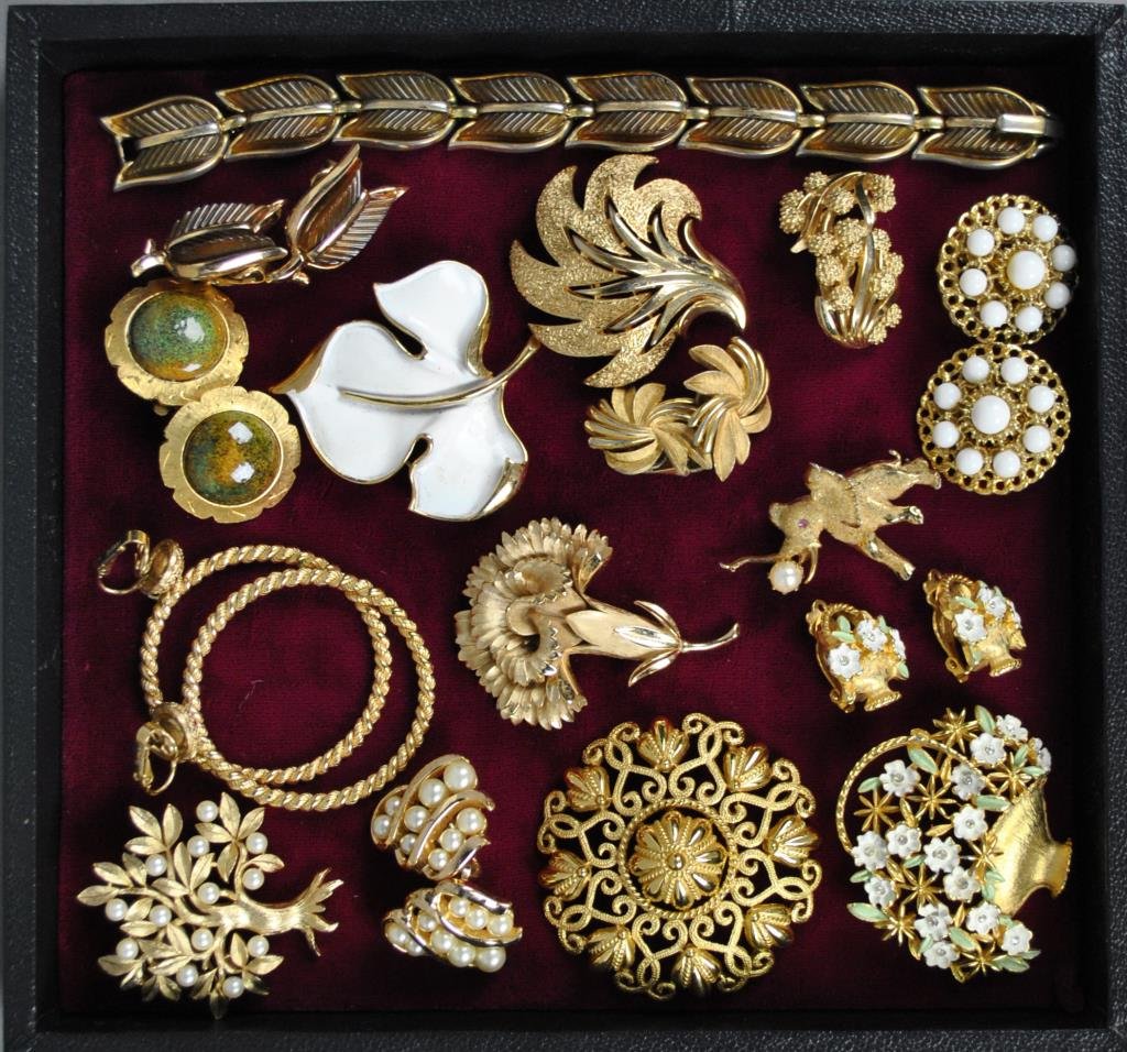 16-PIECE TRIFARI AND KRAMER JEWELRY GROUP: including an enameled flower basket pin and earring set, a bracelet and earring set, an enameled leaf pin, an elephant pin with faux pearl, and other pins and earrings