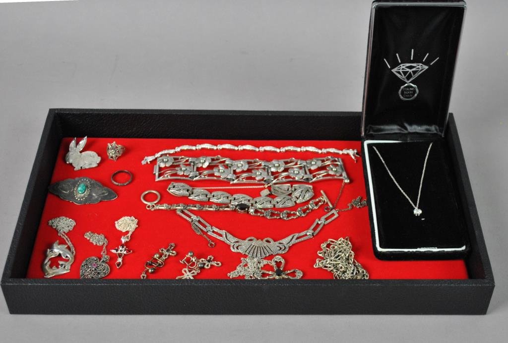20-PIECE STERLING SILVER JEWELRY GROUP: including a bracelet and a dolphin pendant by Gorham, other bracelets and pendants, marcasite pieces, necklaces, pins, earrings, etc.