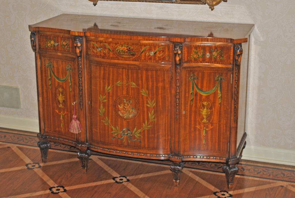 ADAMS STYLE PAINT-DECORATED SATINWOOD COMMODE: 20thC., highly ornamented with cherubs, laurel wreaths, urns, florals and drapery swags, carved ram's heads and bellflowers, 35x51x20in.