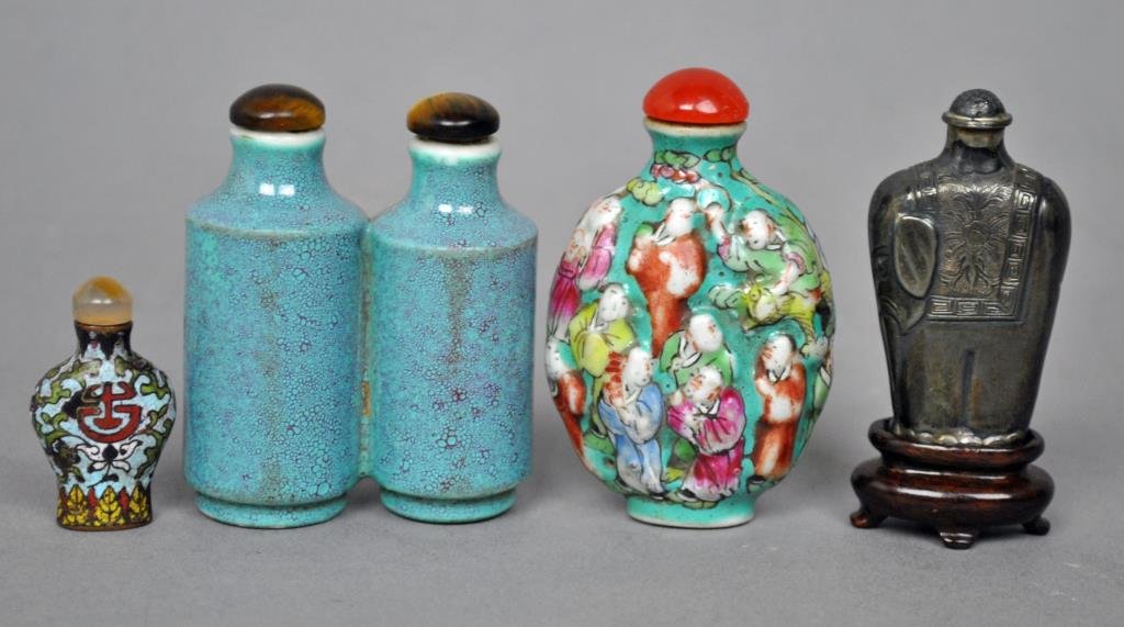 ASSORTED (4) CHINESE SNUFF BOTTLES: including famille rose, a double bottle-form porcelain with tigers eye stoppers, a silvertone metal elephant-form, and a champleve miniature, tallest 2.5in.