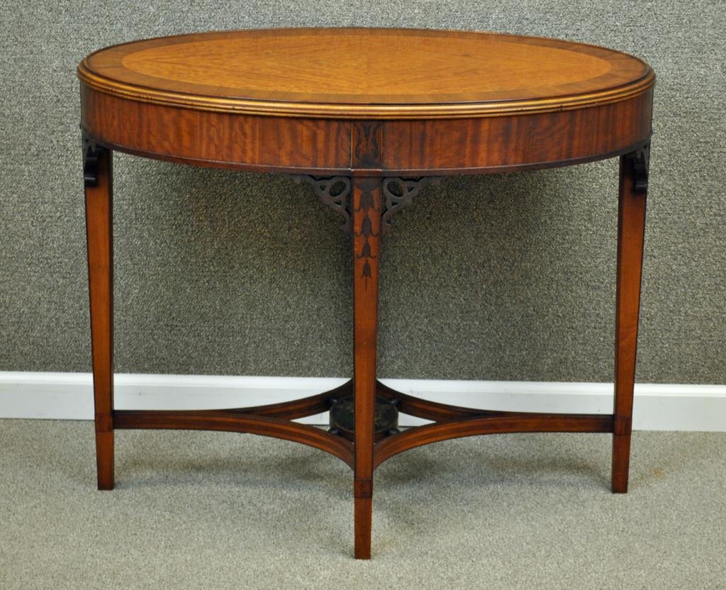 R.W. IRWIN BURLWOOD & PAINT DECORATED TABLE: early 20thC., mahogany banded top, lower shelf painted with putti medallion, tapered legs with painted bellflowers, metal coin label to the underside: 'Royal Furniture Made by Robert W. Irwin Co.', 28