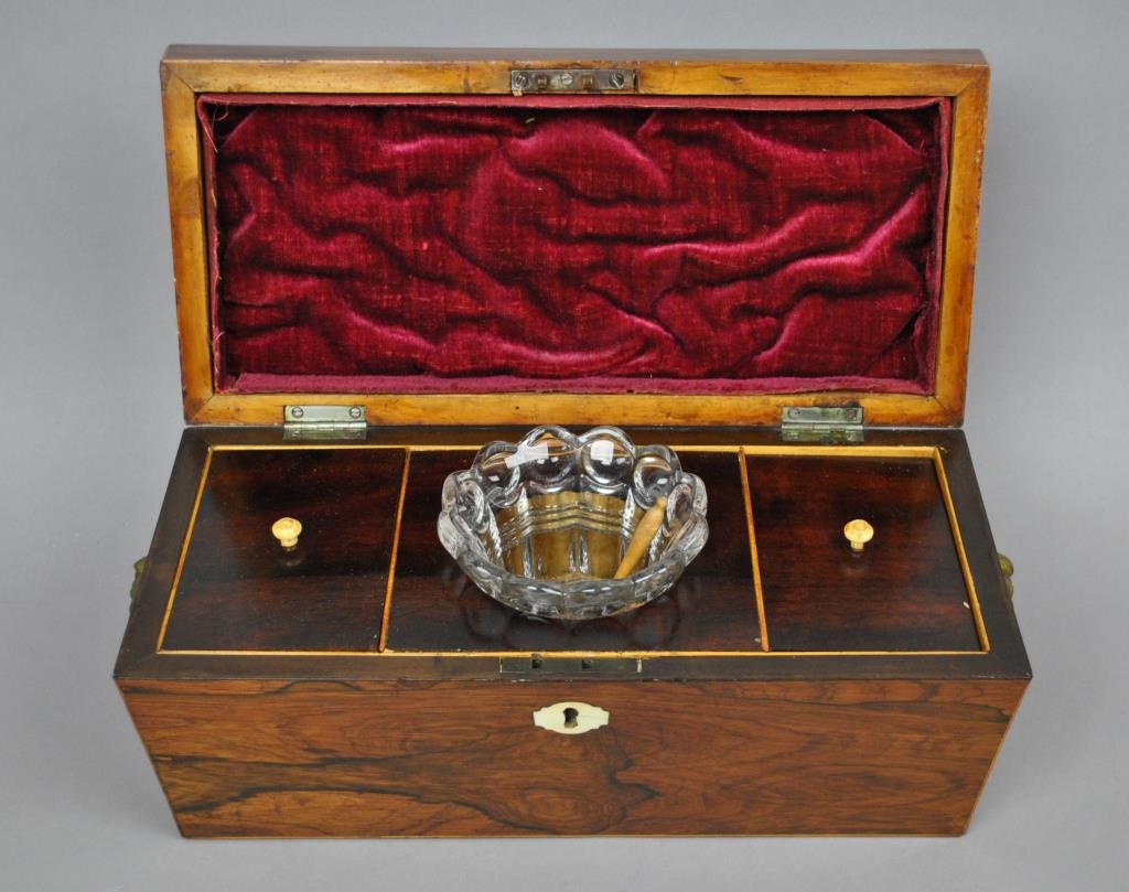 ENGLISH ROSEWOOD TEA CADDY: with ivory key escutcheon, lined interior, lift lids with ivory knobs, brass lion ring handles, lacking feet, 7x16x7in.