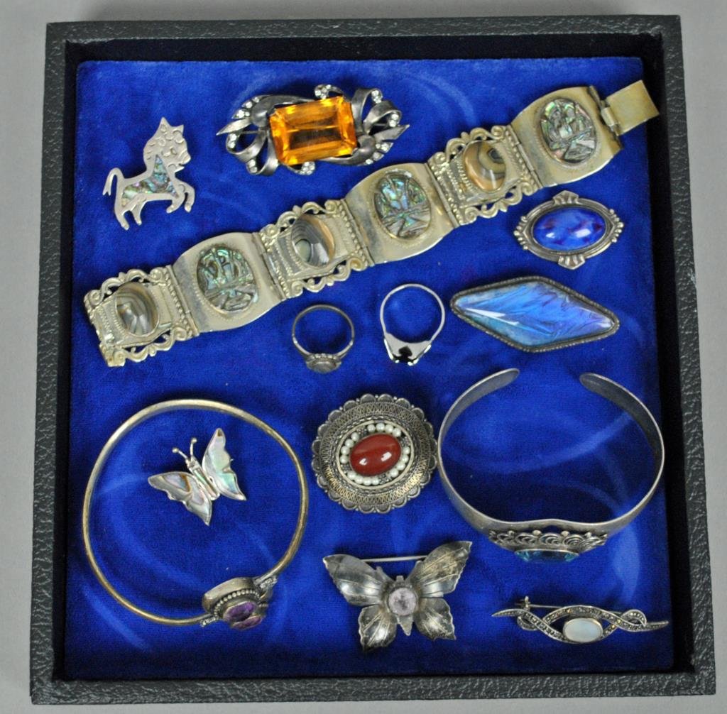 13-PIECE SILVER JEWELRY GROUP: including 12 sterling pieces (bracelets, pins and rings) and one bracelet marked 835S, all set with stones, 5.8ozs.