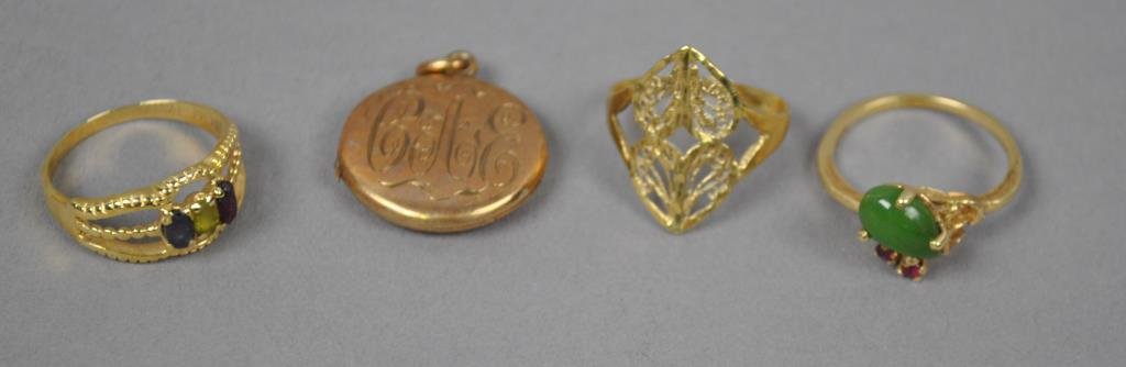 4-PIECE GOLD JEWELRY GROUP: including three rings and a locket pendant with diamond chip, all marked or tested 14K, 13.9gms.