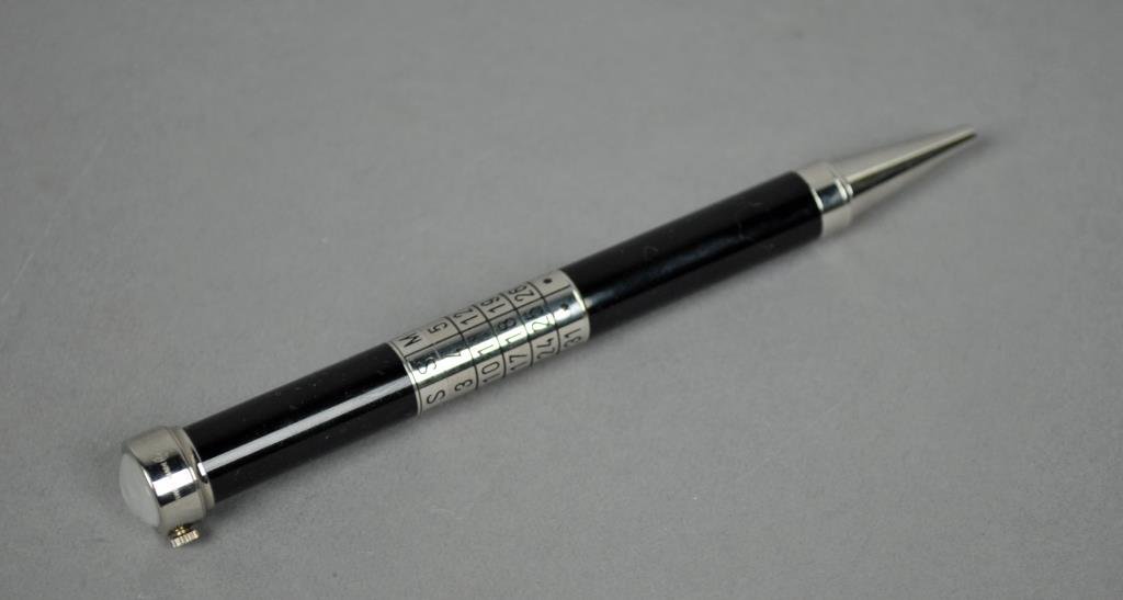 CARTIER LIMITED EDITION CALENDAR/CLOCK PEN: black lacquer ballpoint, No 0574/2000, day/month calendar, crystal Roman numeral clock on end cap, minor plate flake to tip, no case