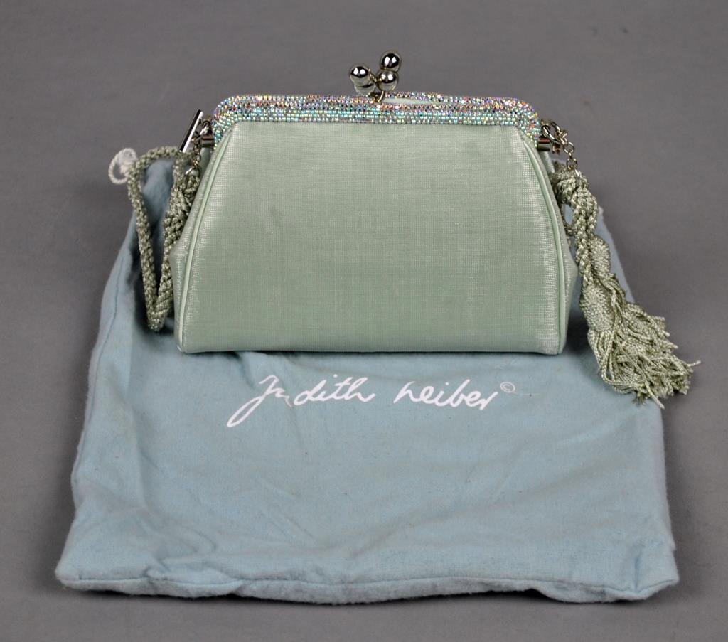 JUDITH LEIBER EVENING CLUTCH: classic Judith Leiber clutch inlaid with Swarovski crystals, the conch closure set with cabochon stones opening to reveal a gold fabric interior with 'Judith Leiber, New York' logo plate, optional sho